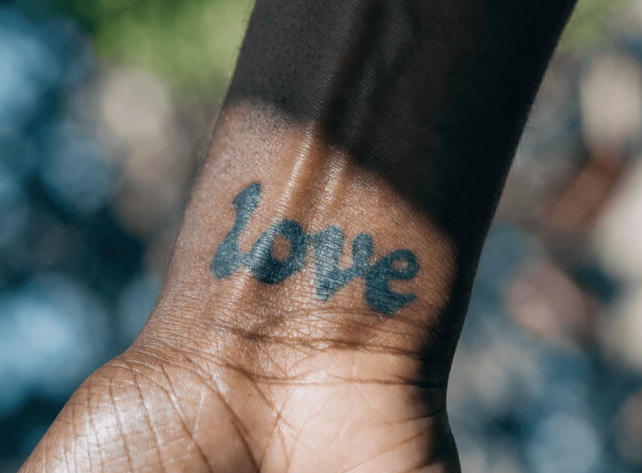 'Love' tattoo on a wrist
